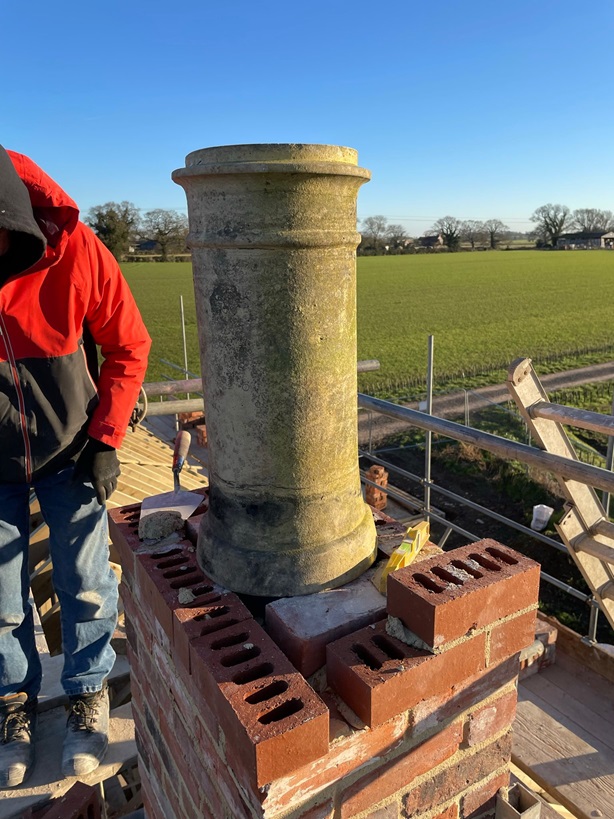 kraft_rebuild - Original chimney being placed back